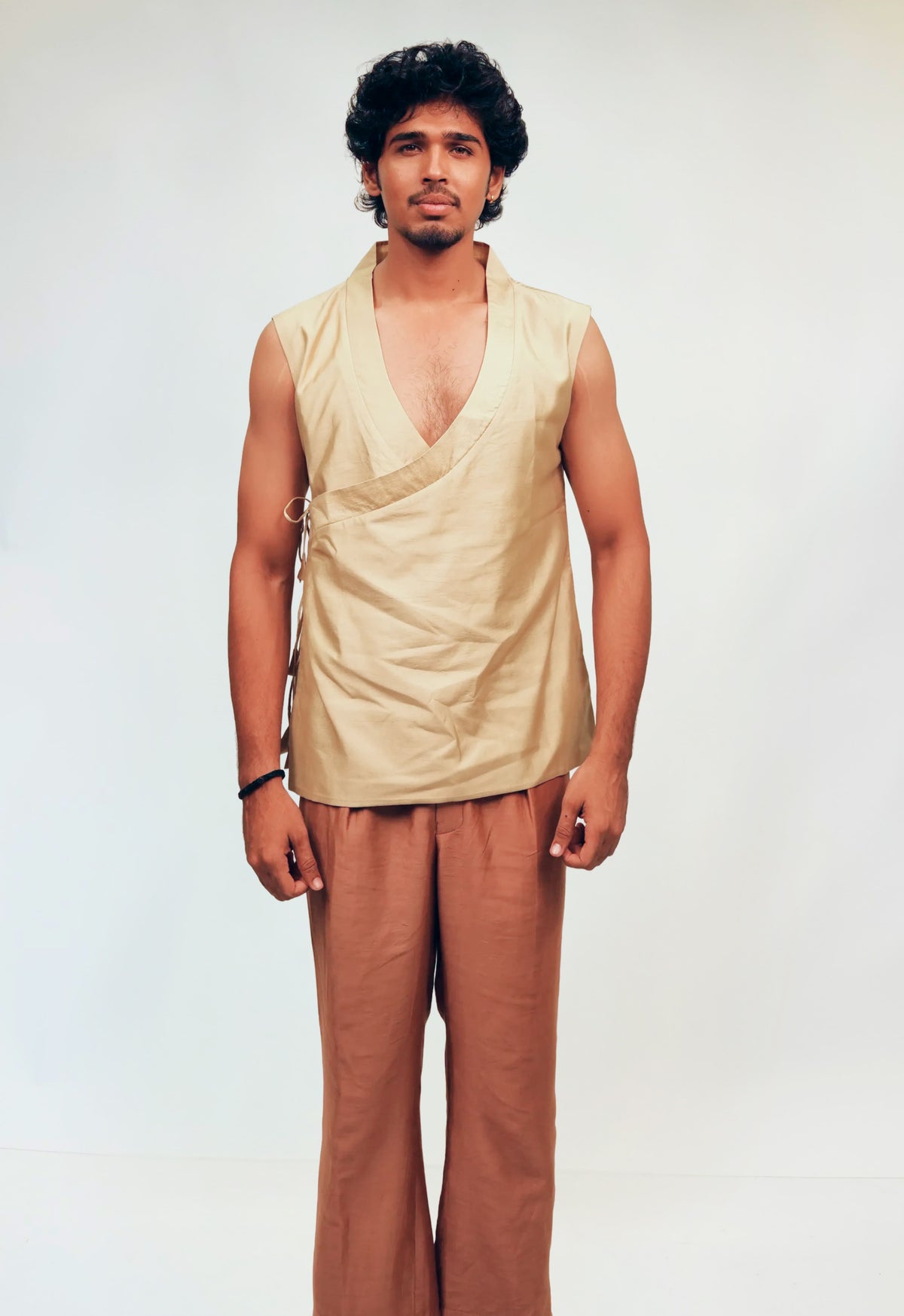 Ivory Wrap-Style Sleeveless Top with Rust Wide-Leg Pants