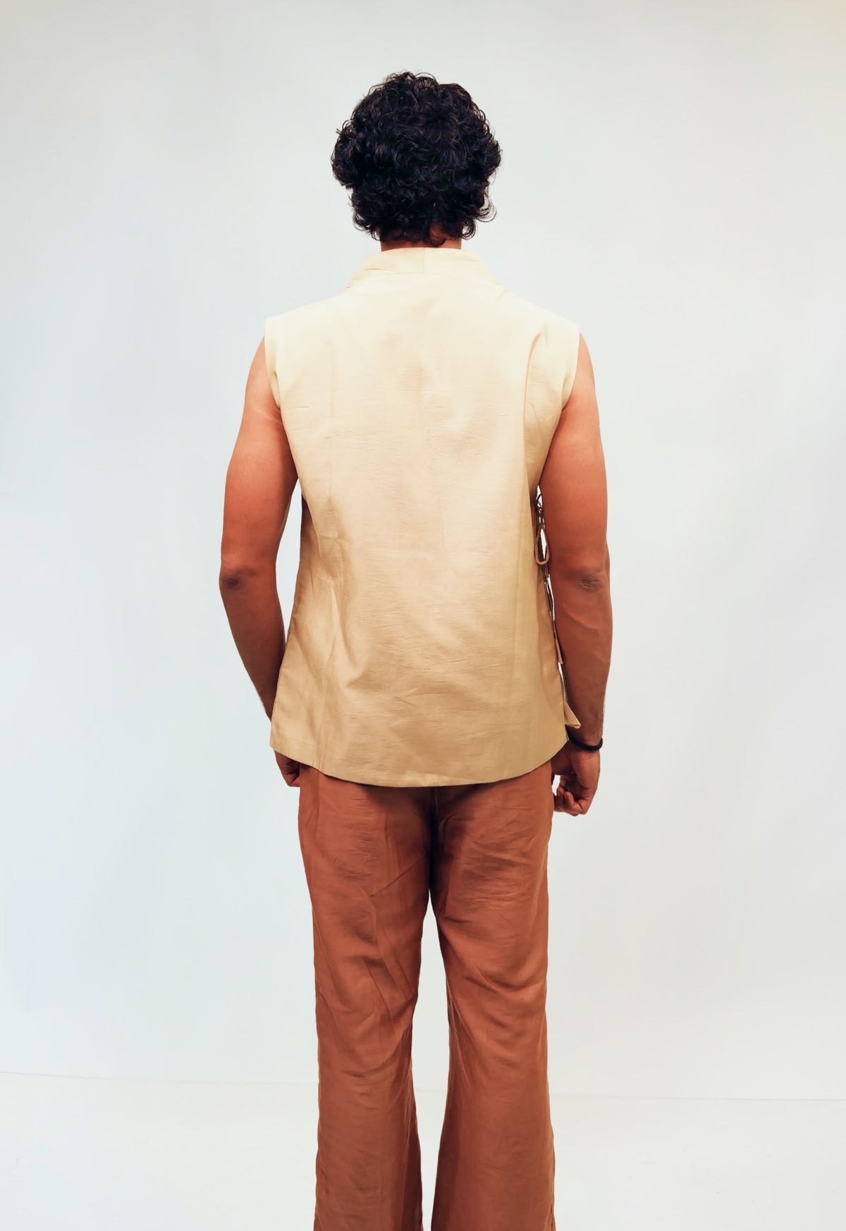 Ivory Wrap-Style Sleeveless Top with Rust Wide-Leg Pants